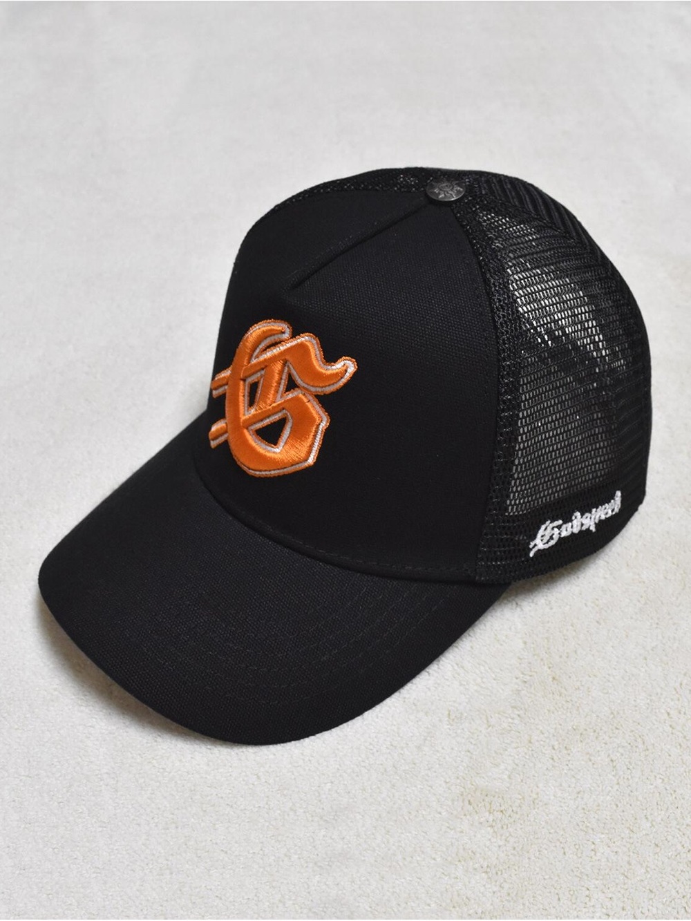 Black Trucker Hat with Orange Embroidered Patch